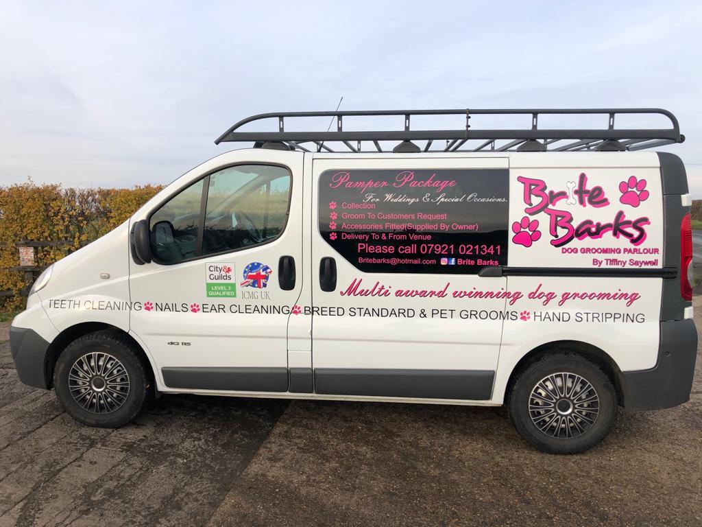 The pink and white Brite Barks van